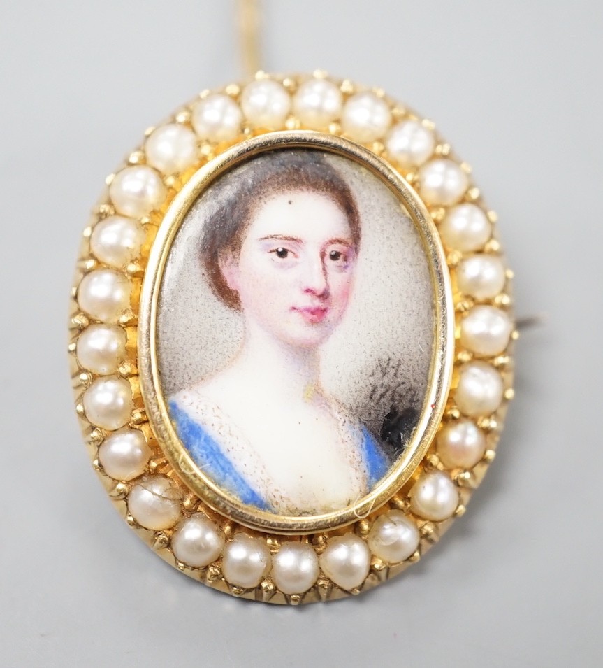 Attributed to Nathaniel Hone (1718-1784) a portrait miniature brooch, the 18th century inset enamel on copper portrait of a young lady mounted and backed in yellow metal, bordered in seed pearls, initialled and dated NH,